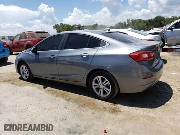 ✅ 2018 Chevrolet Cruze LT • VIN: 1G1BE5SM1J7241431 • Lot: 63491543. Listed on Copart with 64,775 mi. Free auction sales archive from the USA and detailed vehicle history report at DreamBid. Image 2.