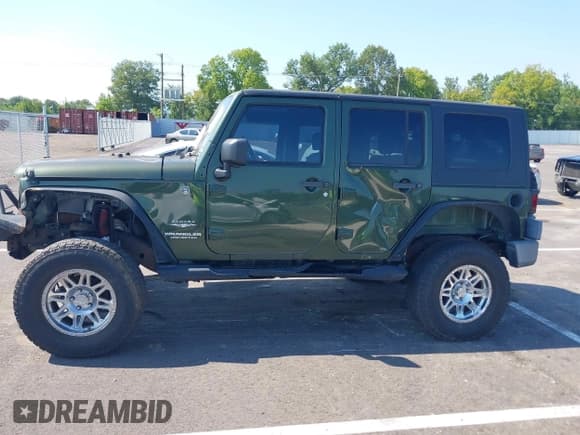 ✅ 2007 Jeep Wrangler Unlimited Sahara • VIN: 1J4GA59157L198095 • Lot: 43011519. Listed on IAAI with 198,022 mi. Free auction sales archive from the USA and detailed vehicle history report at DreamBid. Image 14.