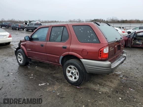✅ 2002 Isuzu Rodeo • VIN: 4S2CK58D124323937 • Lot: 86155194. Listed on Copart with 184,491 mi. Free auction sales archive from the USA and detailed vehicle history report at DreamBid. Image 2.