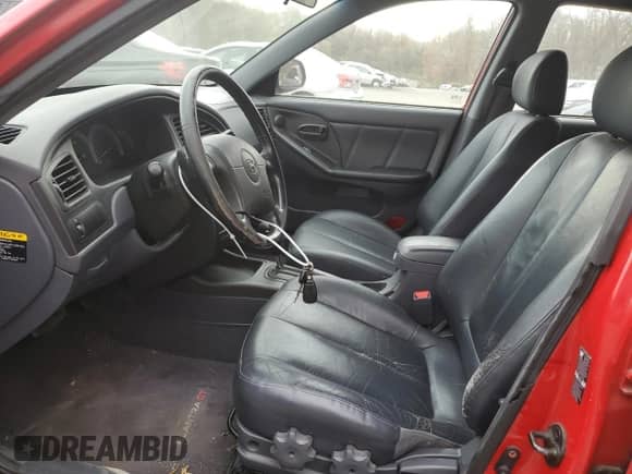 2002 Hyundai Elantra GT z VIN KMHDN55D62U069956, wystawiony jako Copart lot #78931504 z przebiegiem 52 117 mil mil oraz Czysty tytuł • Clean title. Historia ofert i sprzedaży dostępna na DreamBid. Obrazek 7.