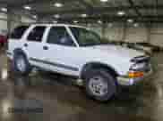 1999 Chevrolet Blazer LS z VIN 1GNDT13W7X2253305, wystawiony jako Copart lot #73501084 z przebiegiem 238 166 mil mil oraz Szkoda całkowita • Salvage title. Historia ofert i sprzedaży dostępna na DreamBid. Obrazek 4.