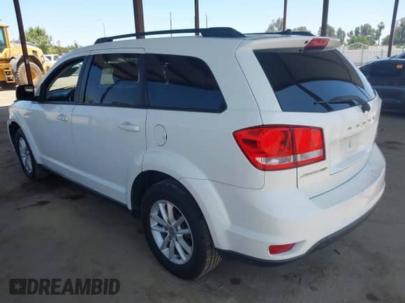 2015 Dodge Journey SXT z VIN 3C4PDCBB5FT568999, wystawiony jako IAAI lot #42527831 z przebiegiem 163 836 mil mil oraz . Historia ofert i sprzedaży dostępna na DreamBid. Obrazek 3.