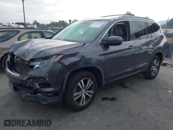 ✅ 2018 Honda Pilot EX-L • VIN: 5FNYF6H57JB014338 • Lot: 43791400. Listed on IAAI with 70,924 mi. Free auction sales archive from the USA and detailed vehicle history report at DreamBid. Image 2.