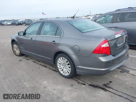 ✅ 2011 Ford Fusion Hybrid • VIN: 3FADP0L33BR116627 • Lot: 43911282. Listed on IAAI with 147,176 mi. Free auction sales archive from the USA and detailed vehicle history report at DreamBid. Image 3.