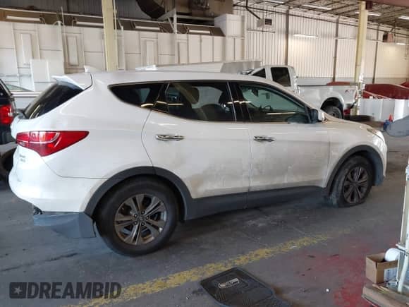 2015 Hyundai Santa Fe z VIN 5XYZTDLB4FG294735, wystawiony jako IAAI lot #43230960 z przebiegiem 169 342 mil mil oraz . Historia ofert i sprzedaży dostępna na DreamBid. Obrazek 14.