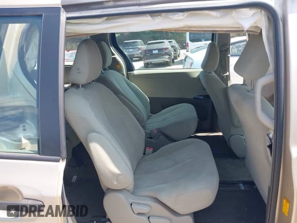 ✅ 2013 Toyota Sienna L • VIN: 5TDZK3DC3DS321573 • Lot: 42948394. Listed on IAAI with 98,780 mi. Free auction sales archive from the USA and detailed vehicle history report at DreamBid. Image 8.