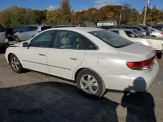 2006 Hyundai Azera SE z VIN KMHFC46FX6A136882, wystawiony jako Copart lot #77377864 z przebiegiem 165 124 mil mil oraz Szkoda całkowita • Salvage title. Historia ofert i sprzedaży dostępna na DreamBid. Obrazek 2.