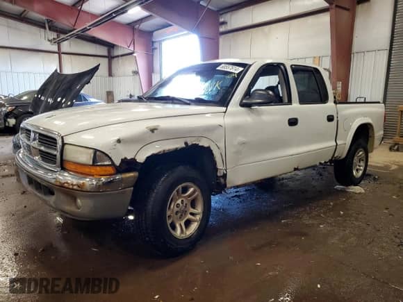 2004 Dodge Dakota SLT z VIN 1D7HG48N14S609085, wystawiony jako Copart lot #68557614 z przebiegiem Nie podano mil oraz Czysty tytuł • Clean title. Historia ofert i sprzedaży dostępna na DreamBid. Obrazek 1.