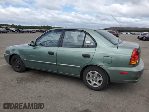 2003 Hyundai Accent GL с VIN KMHCG45CX3U497134, выставлен на аукционе Copart как лот 70932594 с пробегом 107 980 миль миль и Чистый • Clean title. История ставок и продаж доступна на DreamBid. Изображение 2.