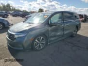 ✅ 2021 Honda Odyssey Touring • VIN: 5FNRL6H82MB006451 • Lot: 82610745. Wystawiony na Copart z przebiegiem 57 220 mil. Bezpłatny archiwum sprzedaży aukcyjnych z USA i szczegółowy raport historii pojazdu na DreamBid. Zdjęcie 1.