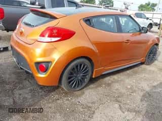 2015 Hyundai Veloster Turbo z VIN KMHTC6AE2FU244523, wystawiony jako IAAI lot #42699013 z przebiegiem 148 262 mil mil oraz . Historia ofert i sprzedaży dostępna na DreamBid. Obrazek 4.