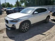 ✅ 2018 BMW X2 sDrive28i • VIN: WBXYJ3C39JEP76836 • Lot: 56415915. Listed on Copart with 112,023 mi. Free auction sales archive from the USA and detailed vehicle history report at DreamBid. Image 1.