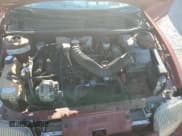 ✅ 1997 Pontiac Sunfire SE • VIN: 1G2JB5240V7537689 • Lot: 82835954. Listed on Copart with 95,860 mi. Free auction sales archive from the USA and detailed vehicle history report at DreamBid. Image 12.