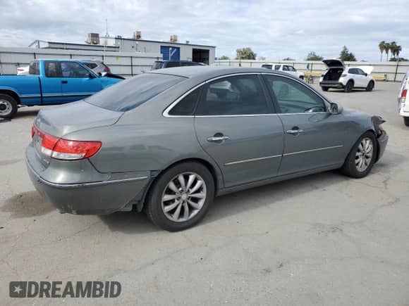 2006 Hyundai Azera SE с VIN KMHFC46F76A054625, выставлен на аукционе Copart как лот 56588315 с пробегом 178 667 миль миль и Списание • Salvage title. История ставок и продаж доступна на DreamBid. Изображение 3.
