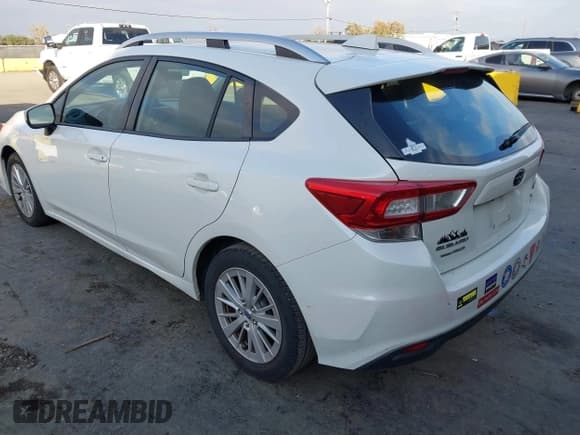 ✅ 2017 Subaru Impreza Premium • VIN: 4S3GTAD69H3719297 • Lot: 43799712. Listed on IAAI with 96,375 mi. Free auction sales archive from the USA and detailed vehicle history report at DreamBid. Image 3.