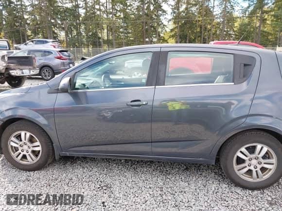 2013 Chevrolet Sonic LT with VIN 1G1JC6SG2D4148084, listed as a IAAI auction lot 43459236 with 94,963 mi miles and . Bid and sale history available at DreamBid. Image 14.