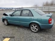 ✅ 2001 Mazda Protege LX • VIN: JM1BJ226510402231 • Lot: 46717595. Wystawiony na Copart z przebiegiem 154 138 mil. Bezpłatny archiwum sprzedaży aukcyjnych z USA i szczegółowy raport historii pojazdu na DreamBid. Zdjęcie 2.