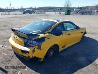 2007 Hyundai Tiburon GT z VIN KMHHN66FX7U258298, wystawiony jako IAAI lot #41619641 z przebiegiem 146 587 mil mil oraz . Historia ofert i sprzedaży dostępna na DreamBid. Obrazek 4.