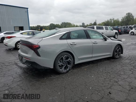 ✅ 2025 Kia K5 GT-Line • VIN: KNAG64J74S5294912 • Лот: 81948525. Опубликован ранее на Copart с пробегом 43 278 миль. Бесплатный доступ к архиву аукционных продаж из США и подробный отчёт об истории автомобиля на DreamBid. Изображение 3.