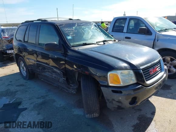 ✅ 2003 GMC Envoy SLE • VIN: 1GKDS13S732134354 • Lot: 41305506. Listed on IAAI with 221,733 mi. Free auction sales archive from the USA and detailed vehicle history report at DreamBid. Image 1.