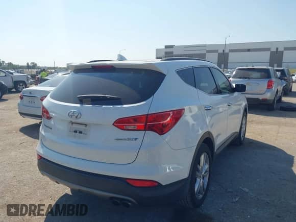2014 Hyundai Santa Fe with VIN 5XYZU3LA7EG183450, listed as a IAAI auction lot 43218232 with 102,132 mi miles and . Bid and sale history available at DreamBid. Image 4.