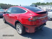 ✅ 2018 Tesla Model X 75D • VIN: 5YJXCDE27JF104964 • Lot: 42860551. Listed on IAAI with 62,176 mi. Free auction sales archive from the USA and detailed vehicle history report at DreamBid. Image 3.