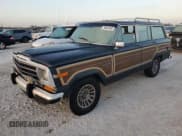 ✅ 1989 Jeep Grand Wagoneer • VIN: 1J4GS5875KP101837 • Лот: 74897344. Опубликован ранее на Copart с пробегом 163 342 миль. Бесплатный доступ к архиву аукционных продаж из США и подробный отчёт об истории автомобиля на DreamBid. Изображение 1.