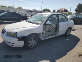 2004 Hyundai Elantra GLS with VIN KMHDN46D34U725333, listed as a Copart auction lot 71259335 with 242,751 mi miles and Salvage title. Bid and sale history available at DreamBid. Image 1.