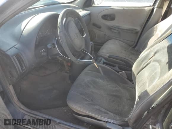 1998 Saturn SL z VIN 1G8ZF5287WZ120978, wystawiony jako Copart lot #43070995 z przebiegiem 279 889 mil mil oraz Szkoda całkowita • Salvage title. Historia ofert i sprzedaży dostępna na DreamBid. Obrazek 7.