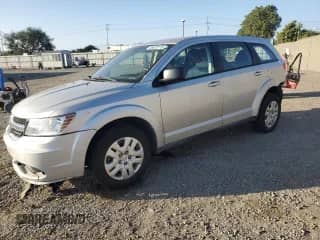 2013 Dodge Journey American Value with VIN 3C4PDCAB2DT671814, listed as a Copart auction lot 82746025 with 118,890 mi miles and Salvage title. Bid and sale history available at DreamBid. Image 1.