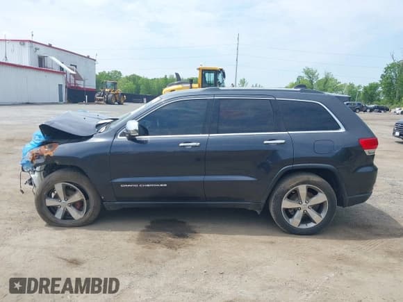 ✅ 2015 Jeep Grand Cherokee Limited • VIN: 1C4RJFBG5FC197773 • Lot: 42161048. Listed on IAAI with 128,257 mi. Free auction sales archive from the USA and detailed vehicle history report at DreamBid. Image 13.