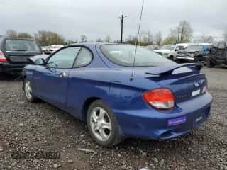 2001 Hyundai Tiburon z VIN KMHJG25F91U250108, wystawiony jako Copart lot #50905795 z przebiegiem 61 803 mil mil oraz Szkoda całkowita • Salvage title. Historia ofert i sprzedaży dostępna na DreamBid. Obrazek 2.