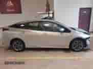 2021 Toyota Prius L Eco with VIN JTDKAMFU4M3147210, listed as a IAAI auction lot 42437023 with 12,673 mi miles and . Bid and sale history available at DreamBid. Image 13.