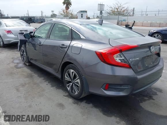 ✅ 2018 Honda Civic EX-T • VIN: JHMFC1F38JX020125 • Lot: 42342438. Listed on IAAI with 115,037 mi. Free auction sales archive from the USA and detailed vehicle history report at DreamBid. Image 3.