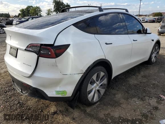 ✅ 2023 Tesla Model Y Long Range • VIN: 7SAYGDEE9PA098533 • Лот: 82690655. Опубликован ранее на Copart с пробегом 59 560 миль. Бесплатный доступ к архиву аукционных продаж из США и подробный отчёт об истории автомобиля на DreamBid. Изображение 3.