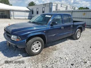 2003 Dodge Dakota Sport z VIN 1D7HL38X73S350060, wystawiony jako Copart lot #56656905 z przebiegiem 189 248 mil mil oraz Szkoda całkowita • Salvage title. Historia ofert i sprzedaży dostępna na DreamBid. Obrazek 1.