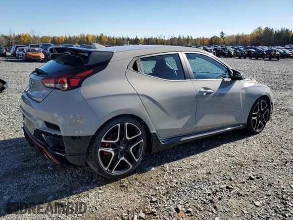 2022 Hyundai Veloster with VIN KMHT36AH7NU011682, listed as a Copart auction lot 77076454 with 73,461 mi miles and Salvage title. Bid and sale history available at DreamBid. Image 3.