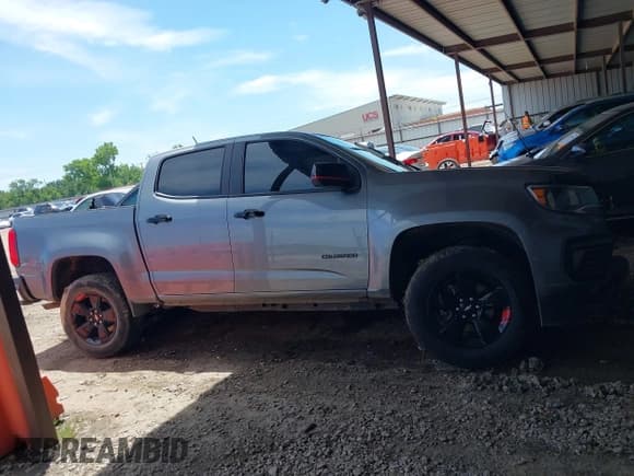 ✅ 2021 Chevrolet Colorado 2WD LT • VIN: 1GCGSCEAXM1127821 • Лот: 42248325. Опубликован ранее на IAAI с пробегом 51 035 миль. Бесплатный доступ к архиву аукционных продаж из США и подробный отчёт об истории автомобиля на DreamBid. Изображение 12.