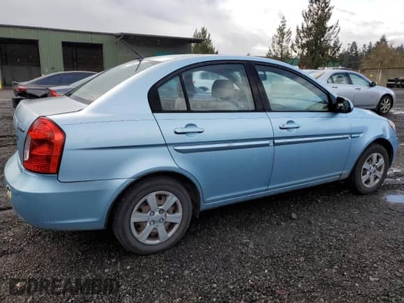 2006 Hyundai Accent GLS with VIN KMHCN46C56U004971, listed as a Copart auction lot 77301034 with 229,170 mi miles and Salvage title. Bid and sale history available at DreamBid. Image 3.