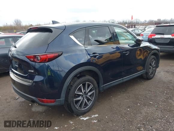 ✅ 2018 Mazda CX-5 Grand Touring • VIN: JM3KFBDM5J0426677 • Lot: 43579829. Listed on IAAI with 94,077 mi. Free auction sales archive from the USA and detailed vehicle history report at DreamBid. Image 4.