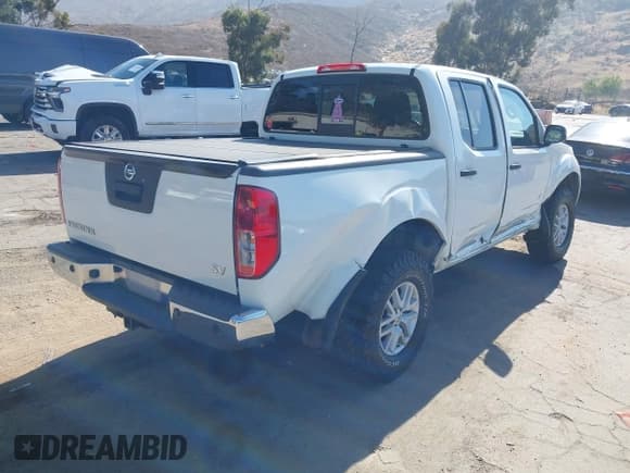 ✅ 2021 Nissan Frontier SV • VIN: 1N6ED0EA2MN704430 • Lot: 42878020. Listed on IAAI with 67,962 mi. Free auction sales archive from the USA and detailed vehicle history report at DreamBid. Image 4.