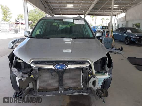 2017 Subaru Forester Touring z VIN JF2SJAWC7HH555670, wystawiony jako IAAI lot #43471642 z przebiegiem 89 476 mil mil oraz . Historia ofert i sprzedaży dostępna na DreamBid. Obrazek 13.