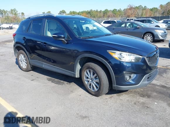 ✅ 2015 Mazda CX-5 Touring • VIN: JM3KE4CY1F0492976 • Lot: 43726497. Listed on IAAI with 201,660 mi. Free auction sales archive from the USA and detailed vehicle history report at DreamBid. Image 1.