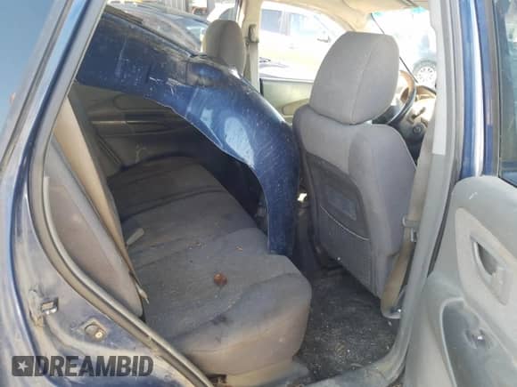 2006 Hyundai Tucson GL z VIN KM8JM72B76U405771, wystawiony jako Copart lot #76751074 z przebiegiem 233 649 mil mil oraz Szkoda całkowita • Salvage title. Historia ofert i sprzedaży dostępna na DreamBid. Obrazek 11.