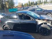 ✅ 2023 Tesla Model Y Long Range • VIN: 7SAYGDEEXPF689909 • Lot: 43551907. Listed on IAAI with 57,191 mi. Free auction sales archive from the USA and detailed vehicle history report at DreamBid. Image 14.