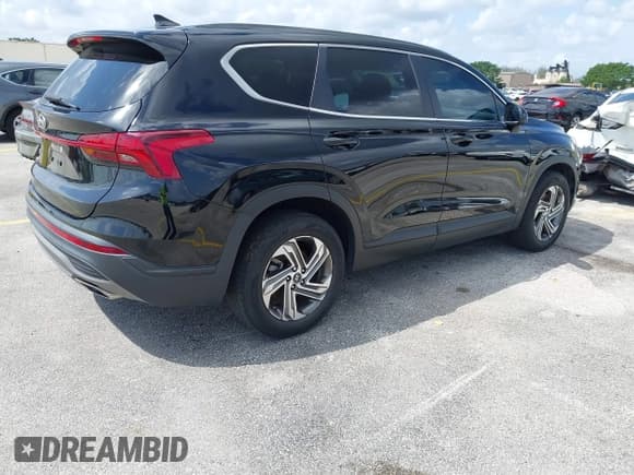 ✅ 2021 Hyundai Santa Fe SE • VIN: 5NMS14AJ0MH309235 • Lot: 41919206. Listed on IAAI with 41,453 mi. Free auction sales archive from the USA and detailed vehicle history report at DreamBid. Image 4.