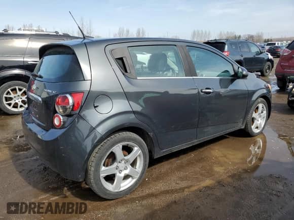 2014 Chevrolet Sonic LT z VIN 1G1JC6EH0E4209809, wystawiony jako Copart lot #51433635 z przebiegiem 127 868 mil mil oraz Czysty tytuł • Clean title. Historia ofert i sprzedaży dostępna na DreamBid. Obrazek 3.
