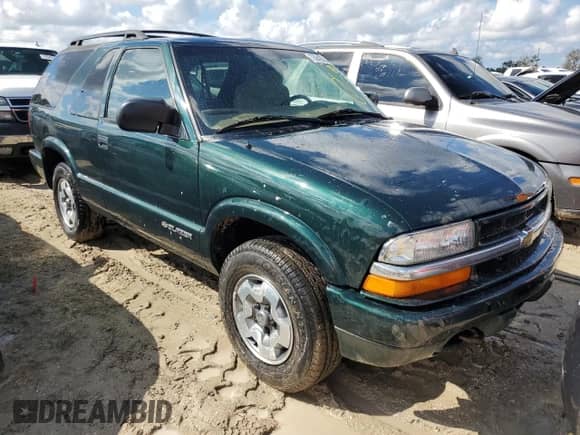2002 Chevrolet Blazer LS z VIN 1GNCT18W52K187799, wystawiony jako Copart lot #73642634 z przebiegiem Nie podano mil oraz Szkoda całkowita • Salvage title. Historia ofert i sprzedaży dostępna na DreamBid. Obrazek 4.