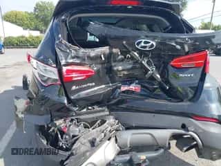 2015 Hyundai Santa Fe with VIN 5XYZU3LB8FG295846, listed as a IAAI auction lot 43174087 with 105,223 mi miles and . Bid and sale history available at DreamBid. Image 6.