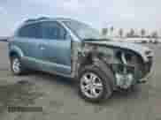 2008 Hyundai Tucson SE with VIN KM8JN72D98U843161, listed as a Copart auction lot 71192824 with 142,822 mi miles and Salvage title. Bid and sale history available at DreamBid. Image 4.